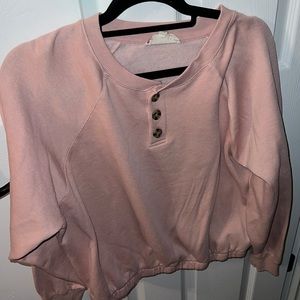 Large pink button sweatshirt.